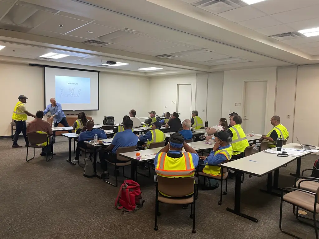 Bill teaching open posture to transit professionals